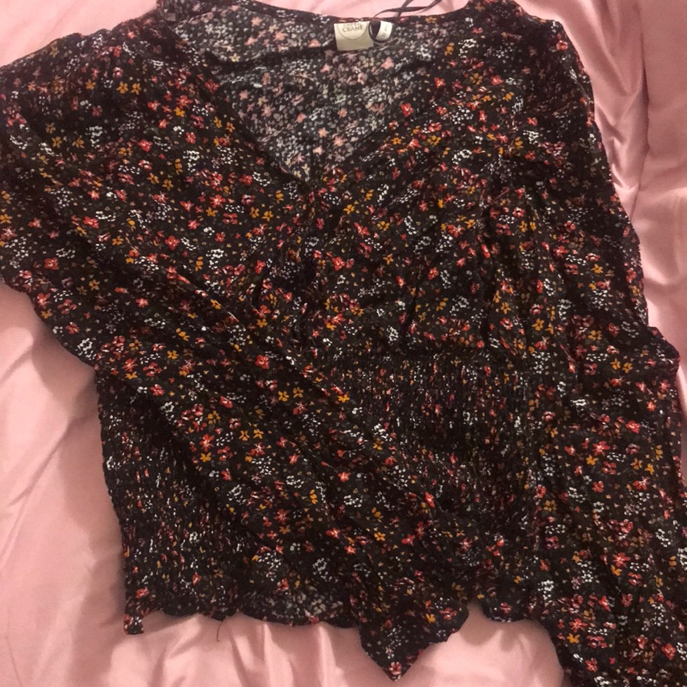 black blouse with red,orange and white flowers